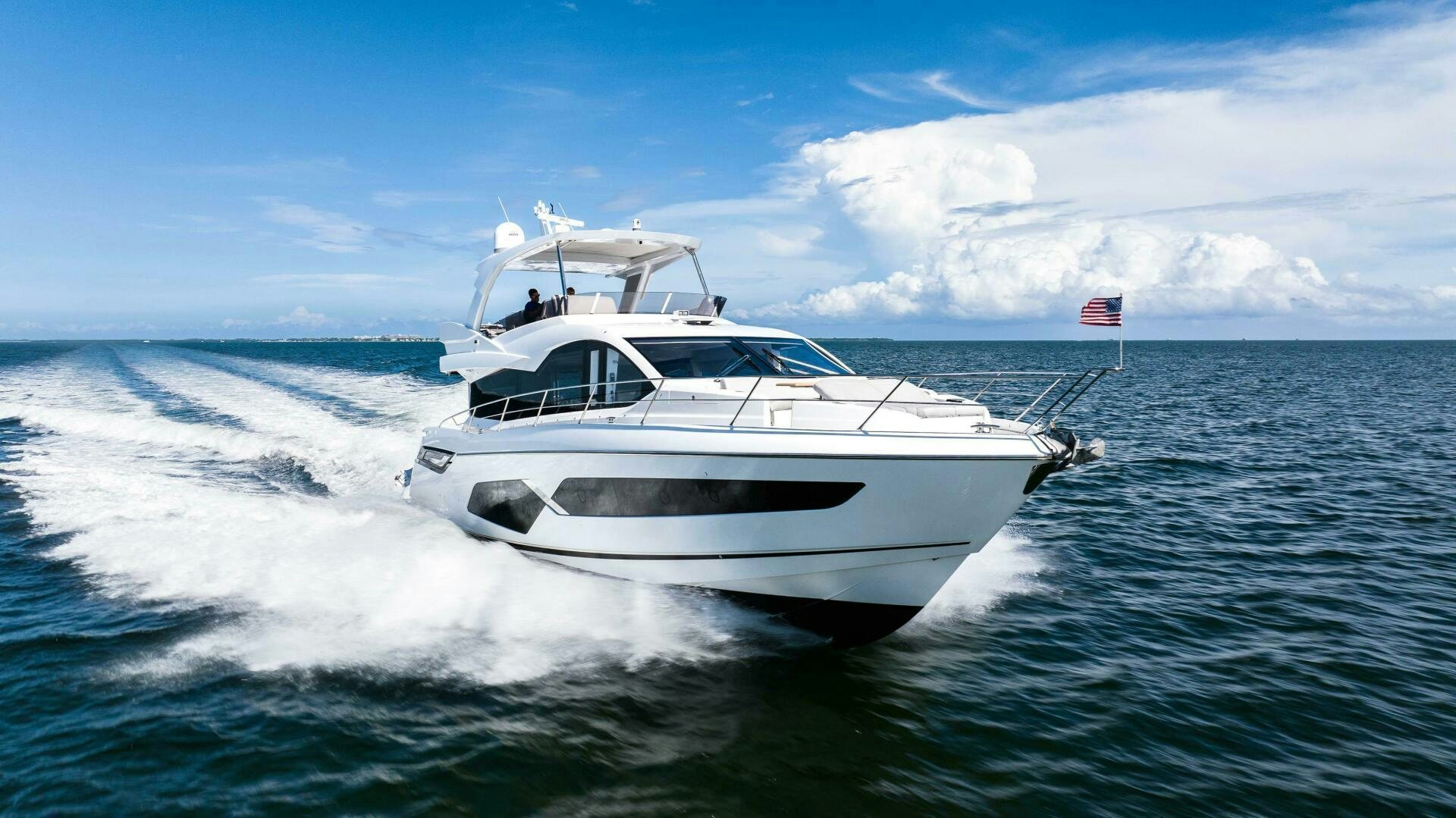 a white yacht on the water aboard 4-PLAY VII Yacht for Sale