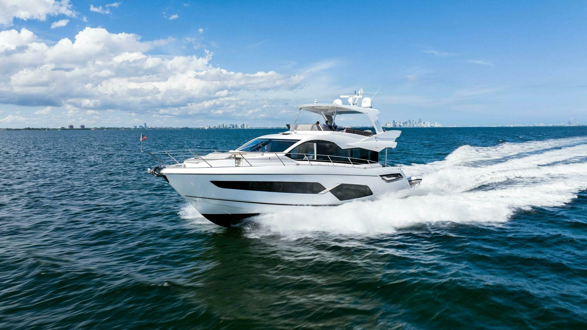 a white yacht on the water aboard 4-PLAY VII Yacht for Sale