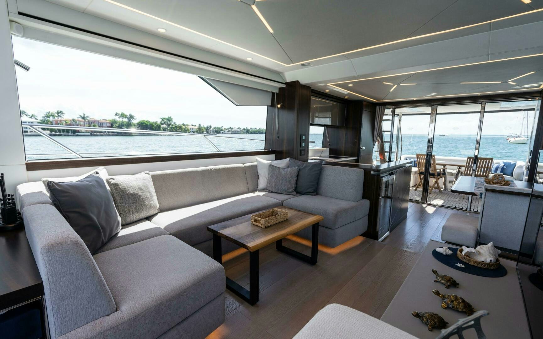 a living room with a large window aboard 4-PLAY VII Yacht for Sale