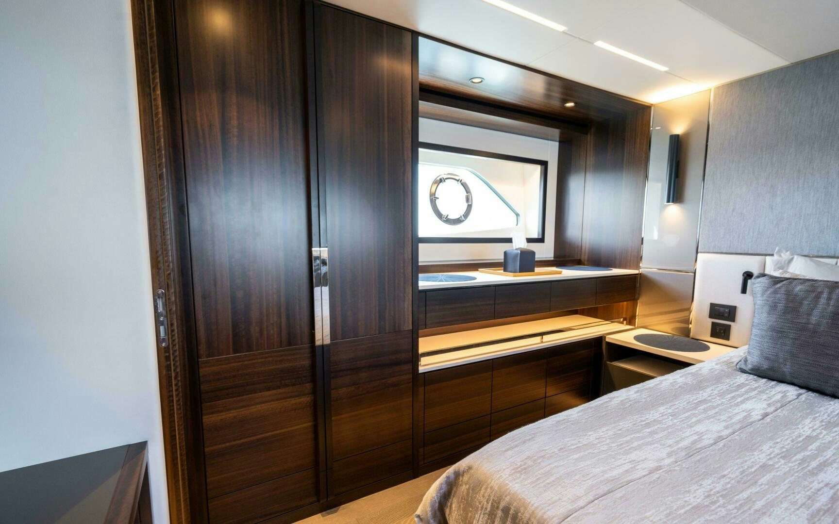 a room with a bed and a closet aboard 4-PLAY VII Yacht for Sale