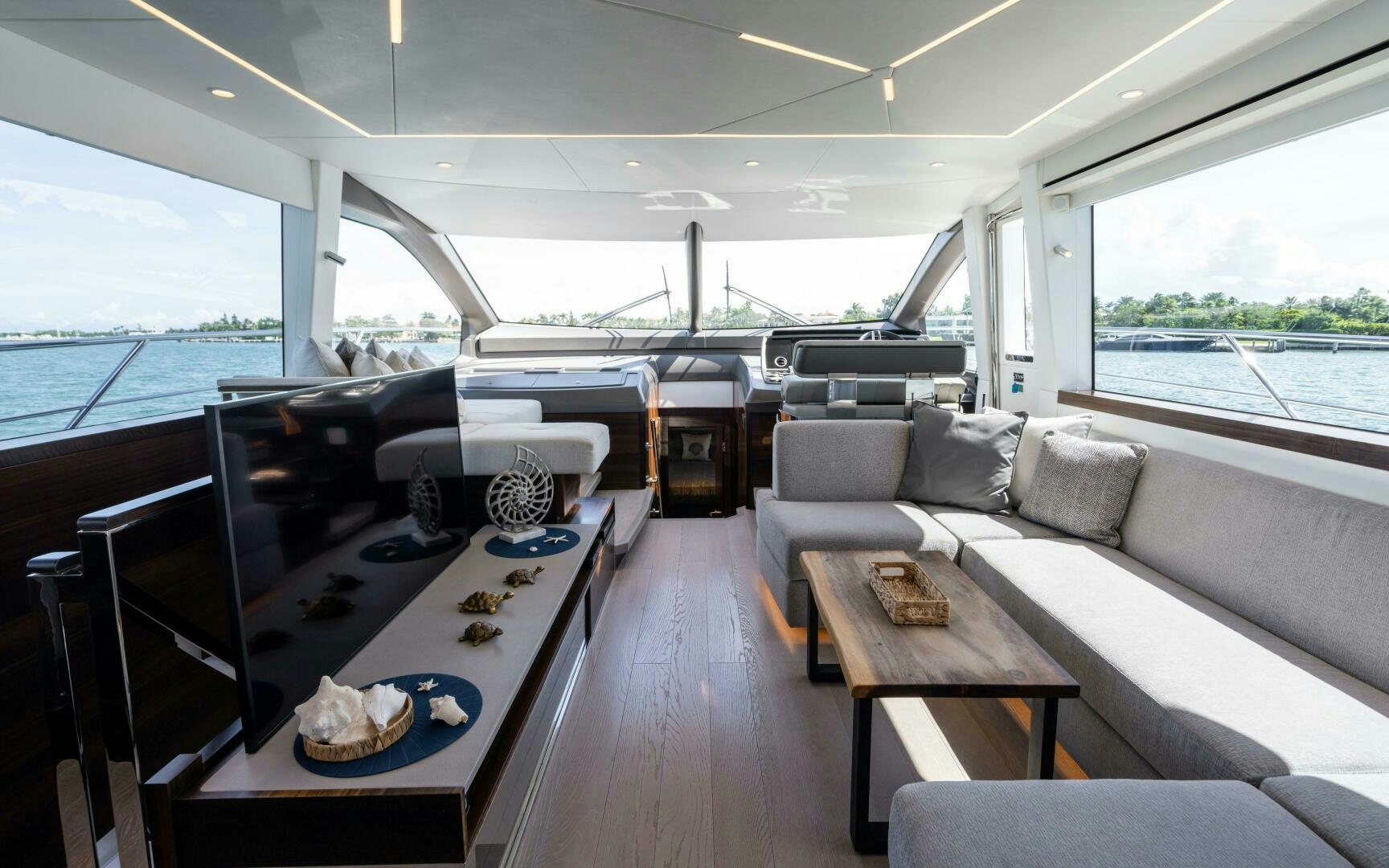 a room with a couch and a table with a rug on it aboard 4-PLAY VII Yacht for Sale