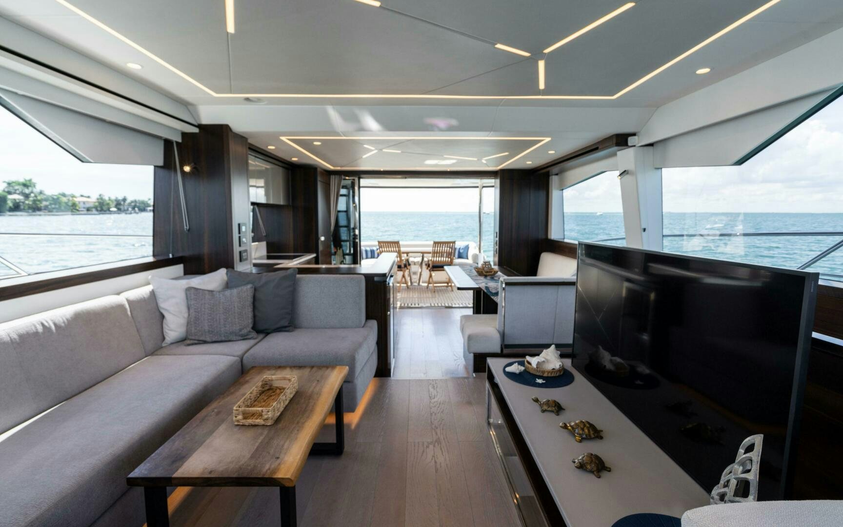 a living room with a couch and a table aboard 4-PLAY VII Yacht for Sale