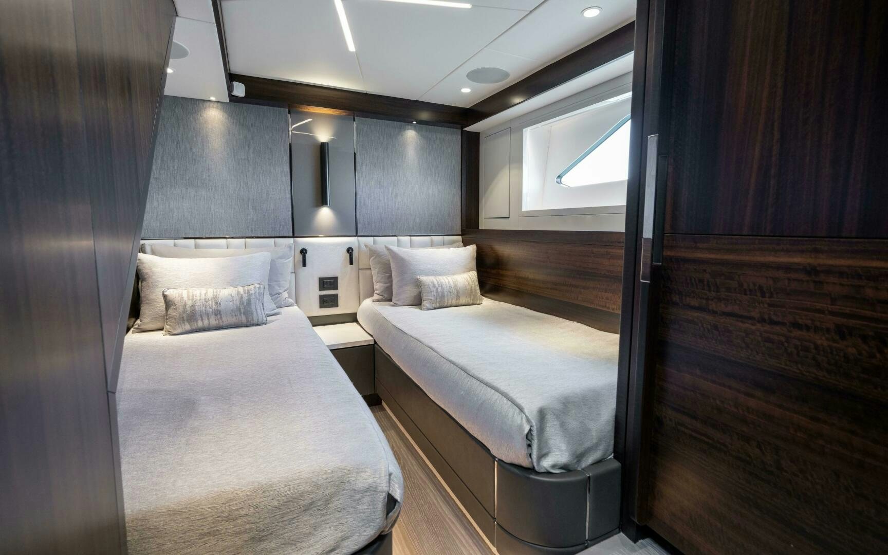 a room with two beds aboard 4-PLAY VII Yacht for Sale