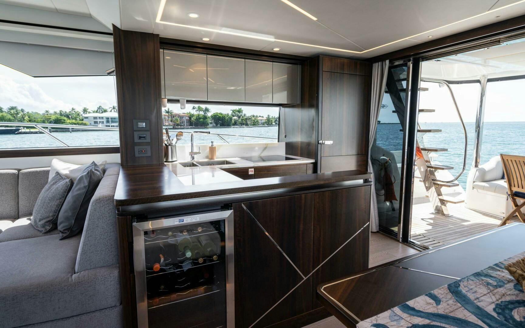 a living room with a fireplace aboard 4-PLAY VII Yacht for Sale