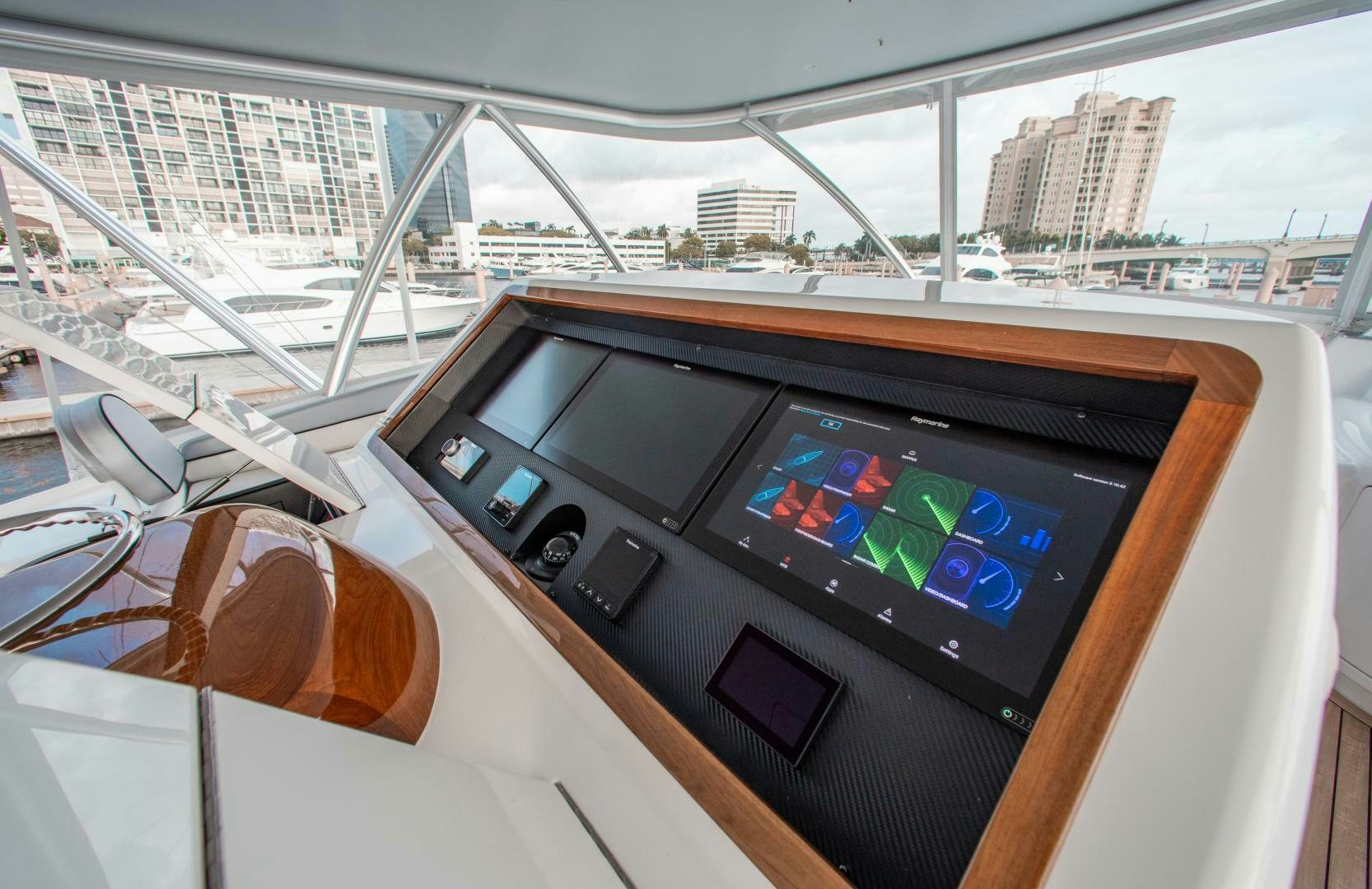 a hand holding a device aboard AEI Yacht for Sale