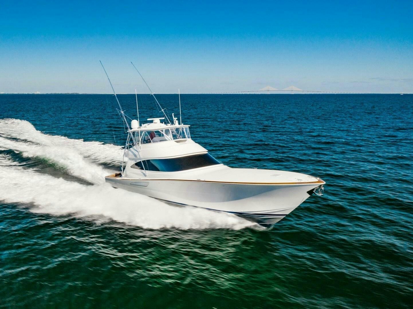 a white boat in the water aboard AEI Yacht for Sale