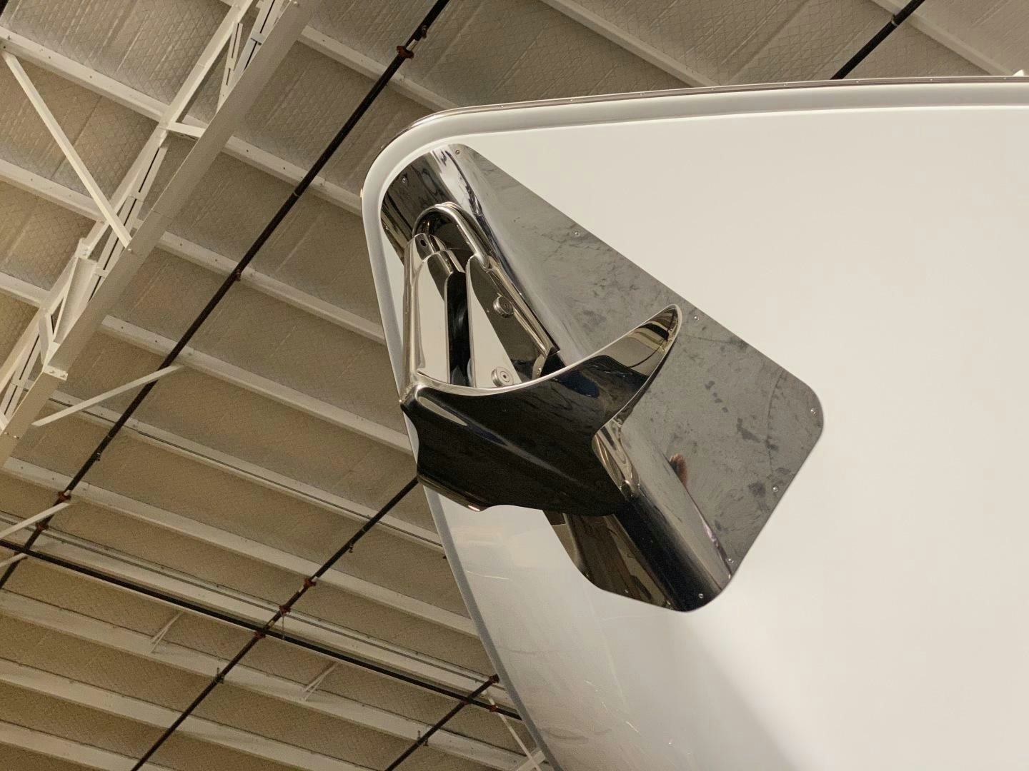 a car parked on a staircase aboard AEI Yacht for Sale