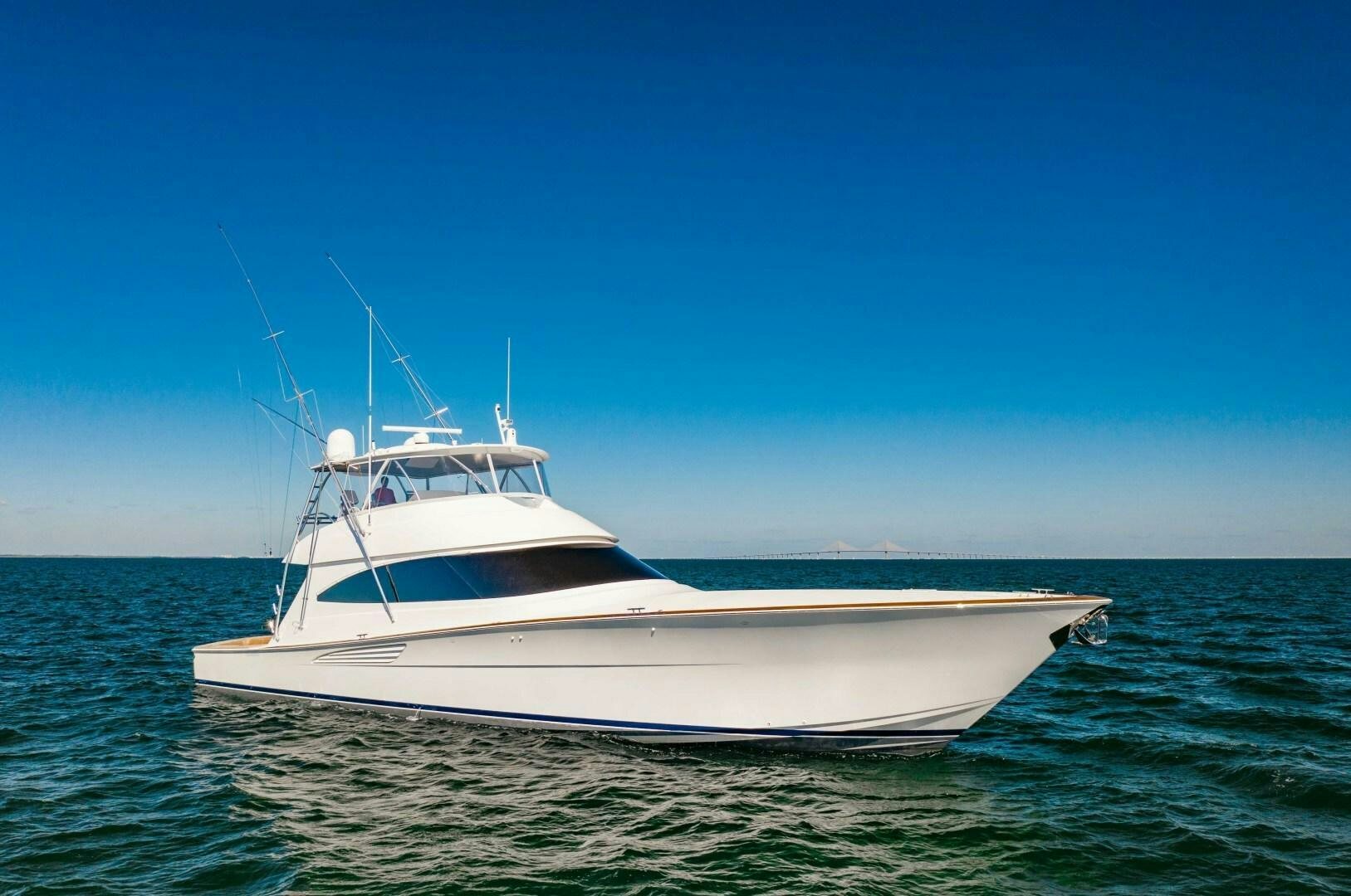 a white boat in the water aboard AEI Yacht for Sale