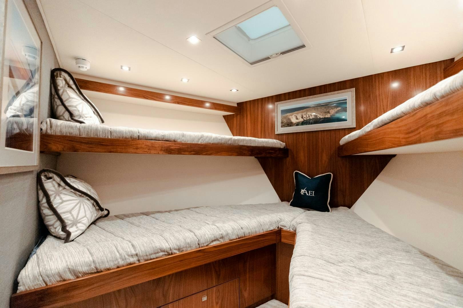 a bed with a laptop on it aboard AEI Yacht for Sale