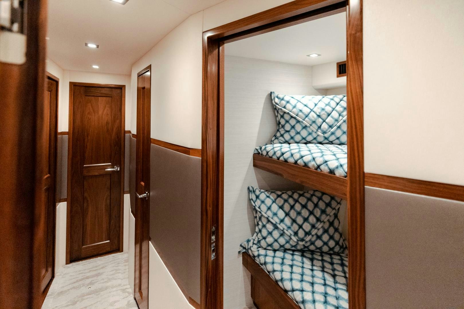 a room with a bed and a closet aboard AEI Yacht for Sale