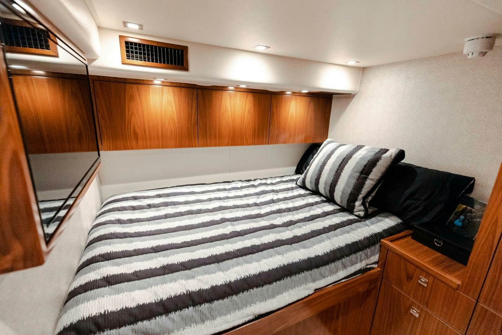 a bed in a room aboard AEI Yacht for Sale