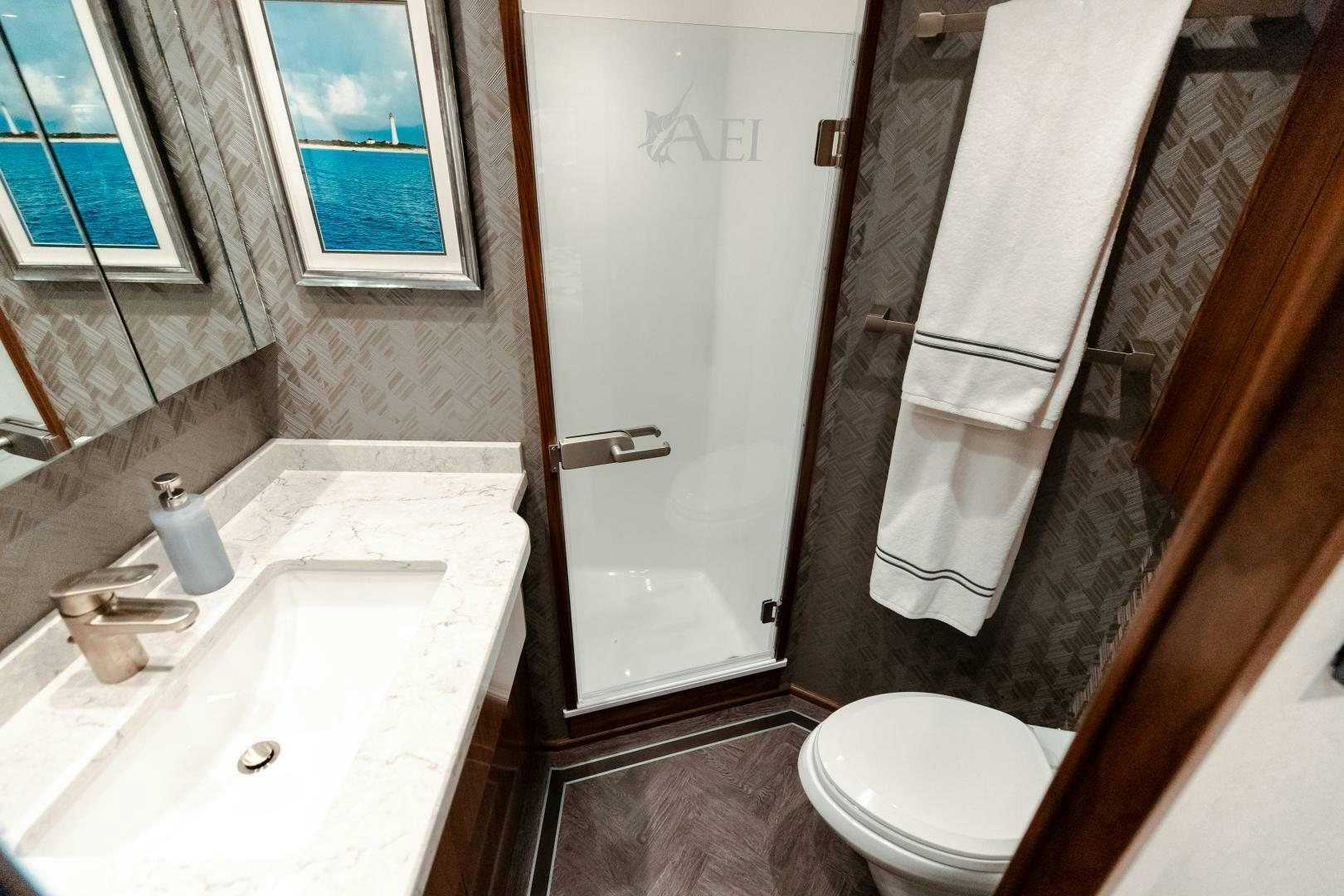 a bathroom with a sink and toilet aboard AEI Yacht for Sale