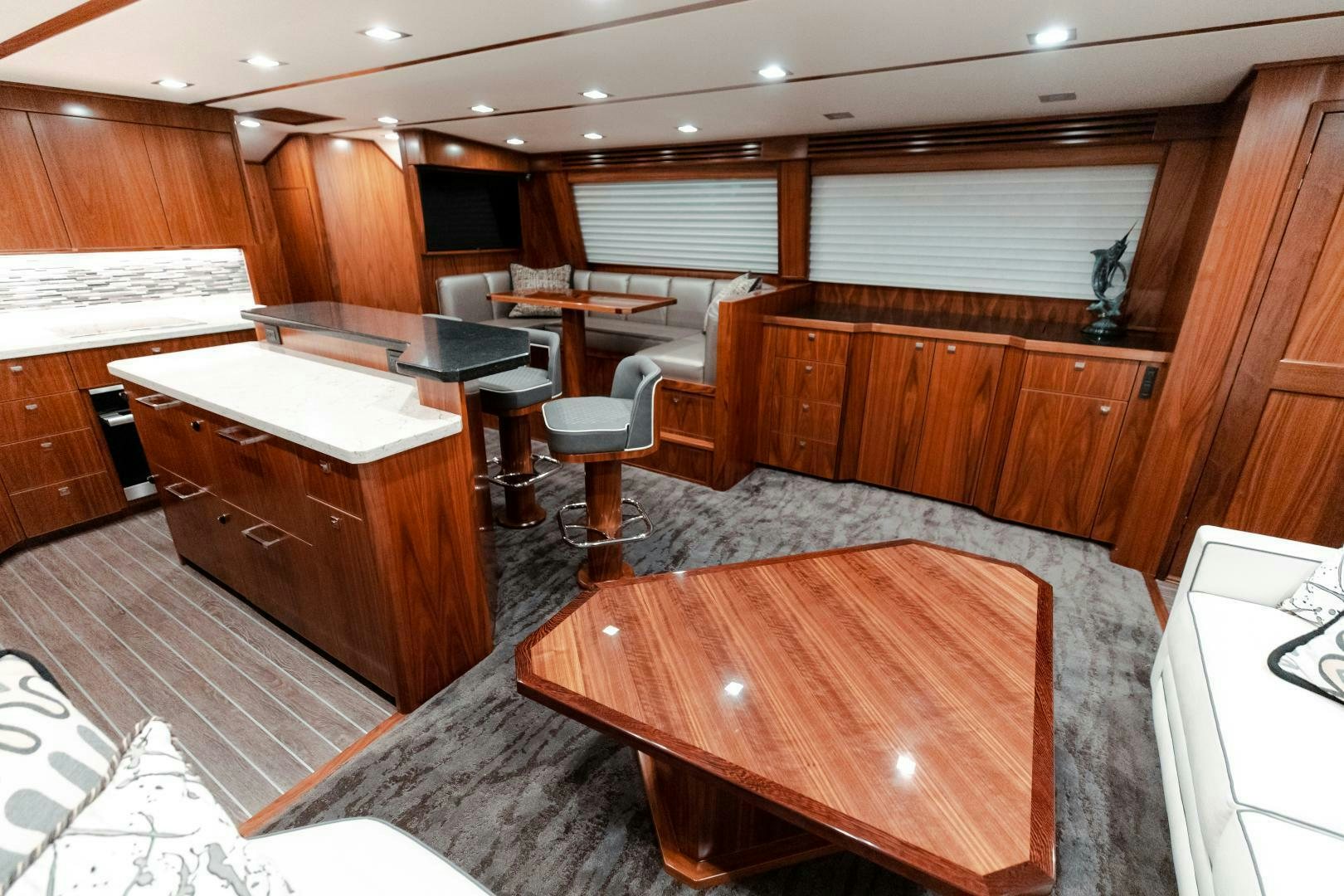 a room with a table and chairs aboard AEI Yacht for Sale