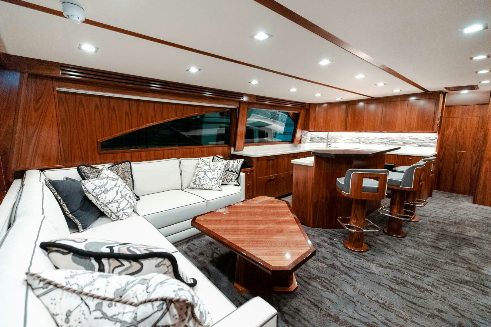 a room with a bed and a desk aboard AEI Yacht for Sale