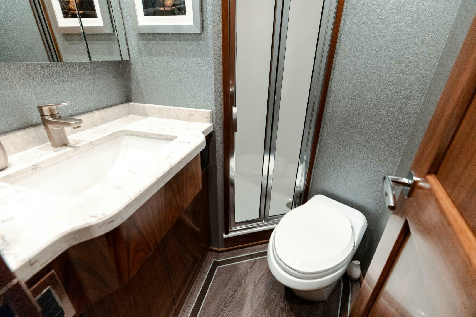 a bathroom with a sink and toilet aboard AEI Yacht for Sale