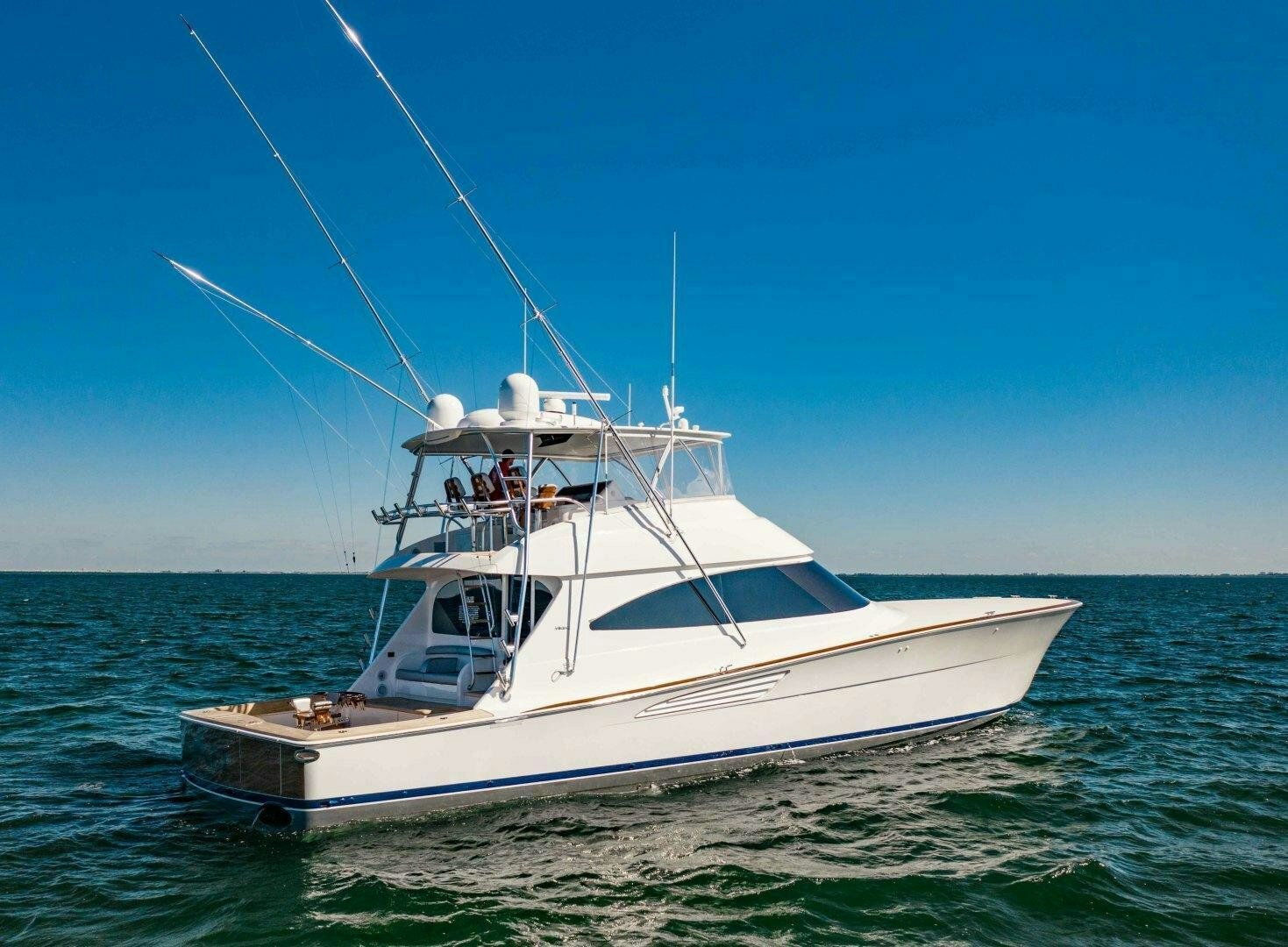 a white boat in the water aboard AEI Yacht for Sale