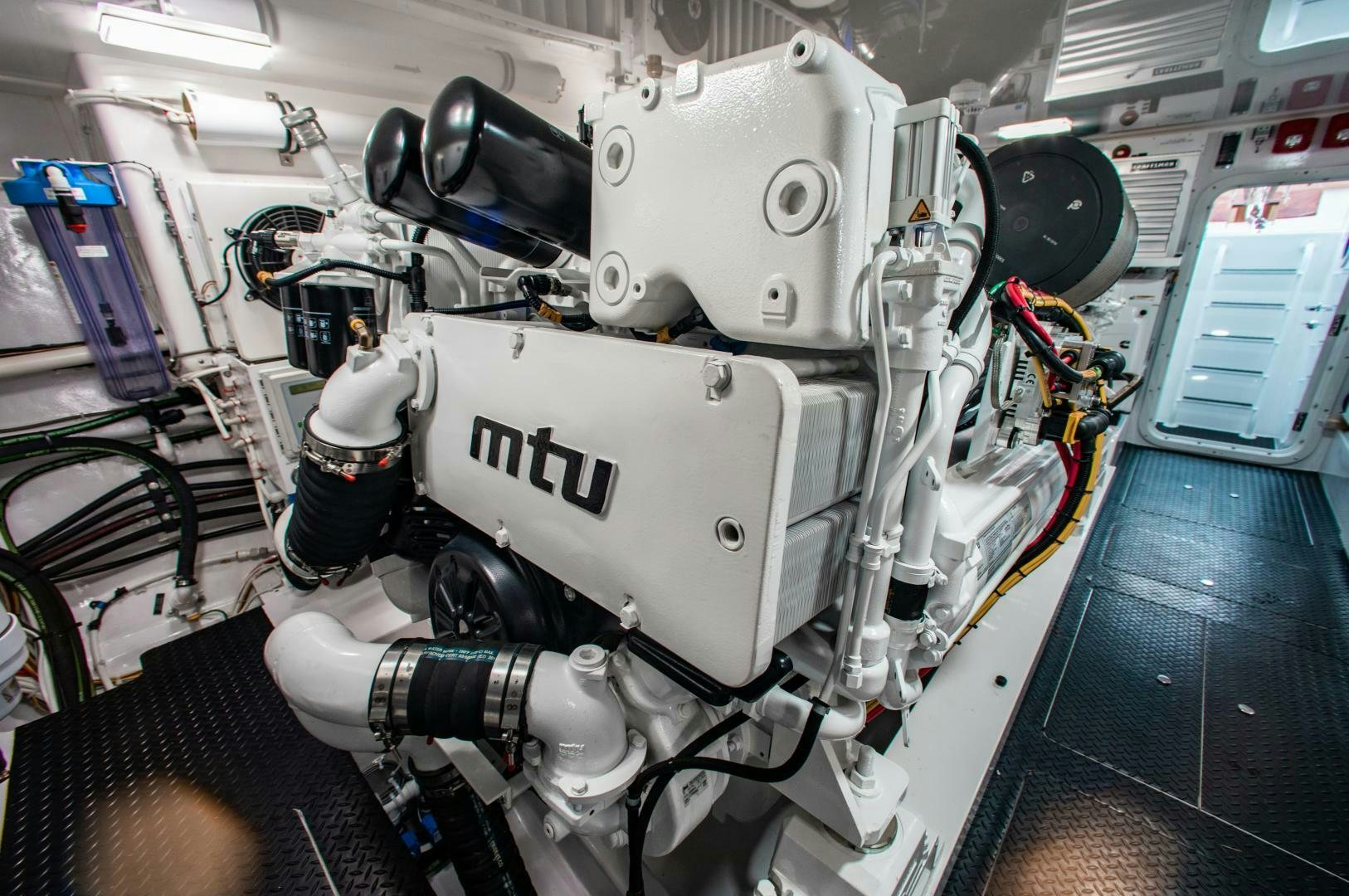 a white machine with black wheels aboard AEI Yacht for Sale