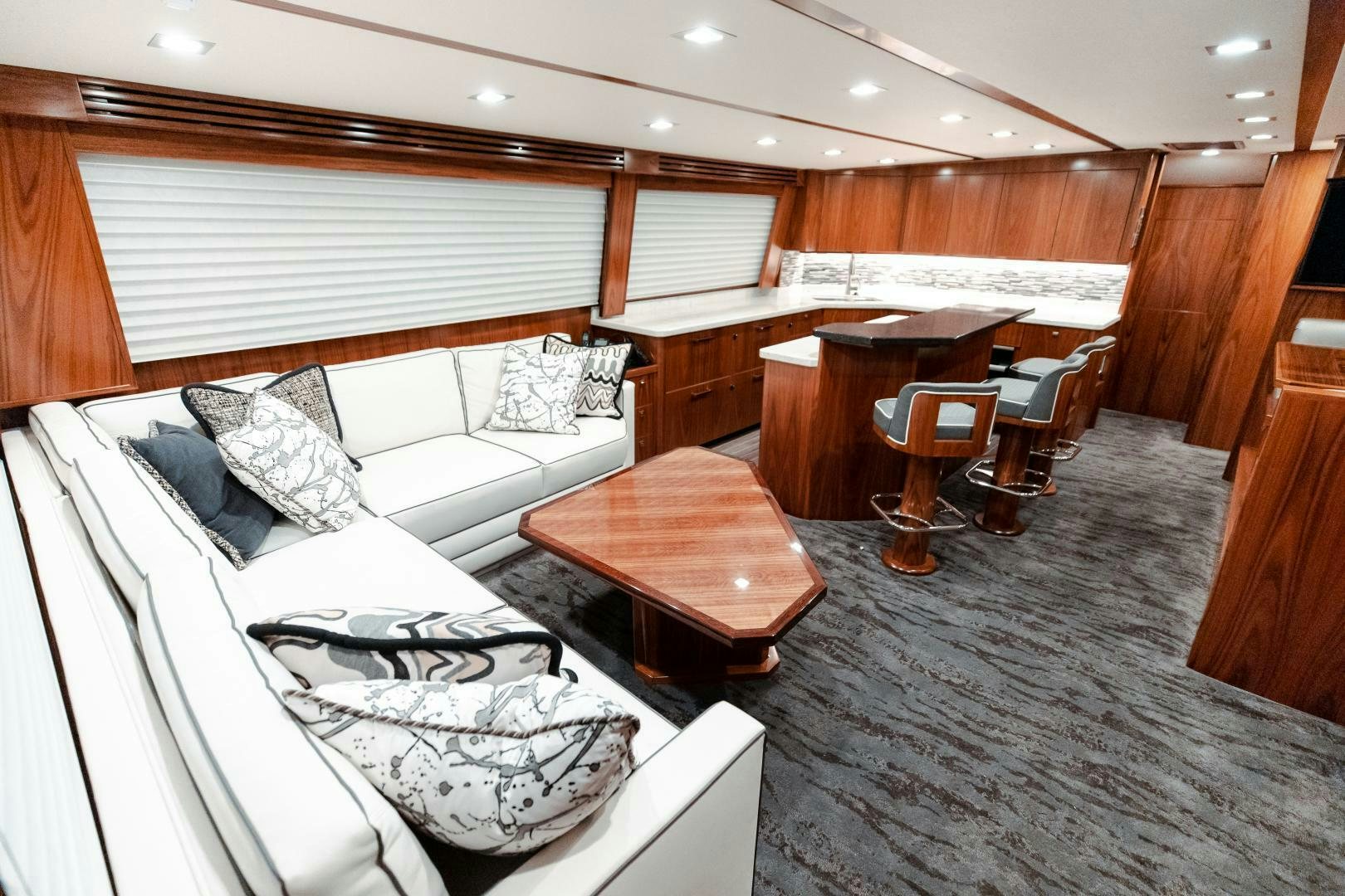 a room with a bed and a desk aboard AEI Yacht for Sale