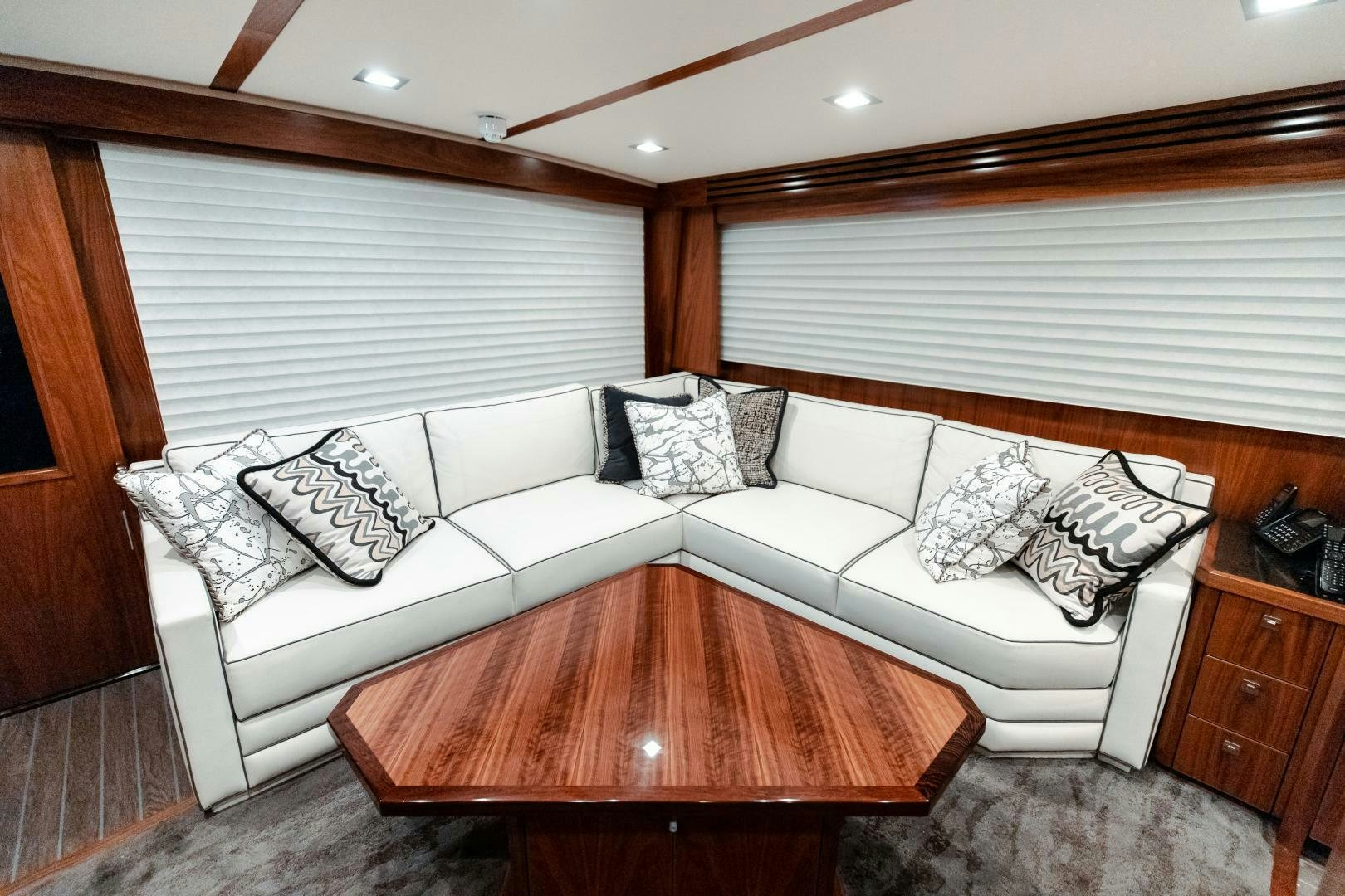 a couch with pillows on it aboard AEI Yacht for Sale
