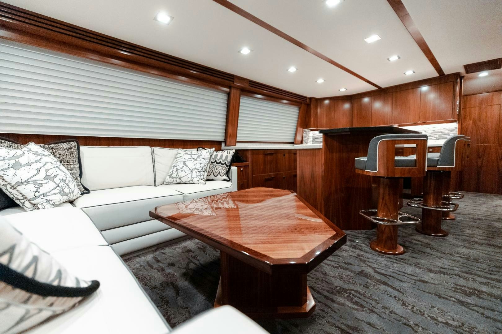a room with a bed and a table aboard AEI Yacht for Sale