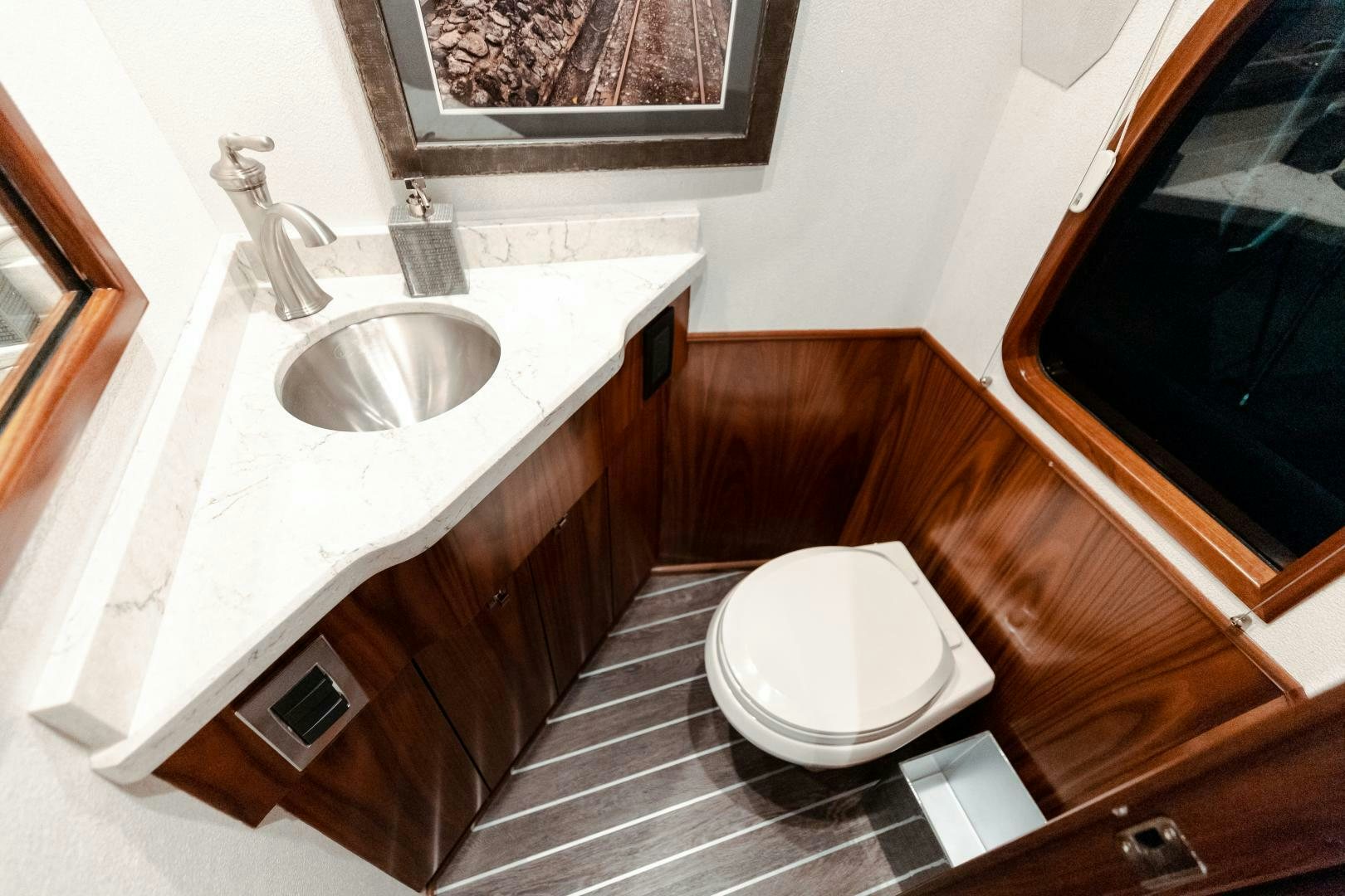 a bathroom with a sink and a toilet aboard AEI Yacht for Sale