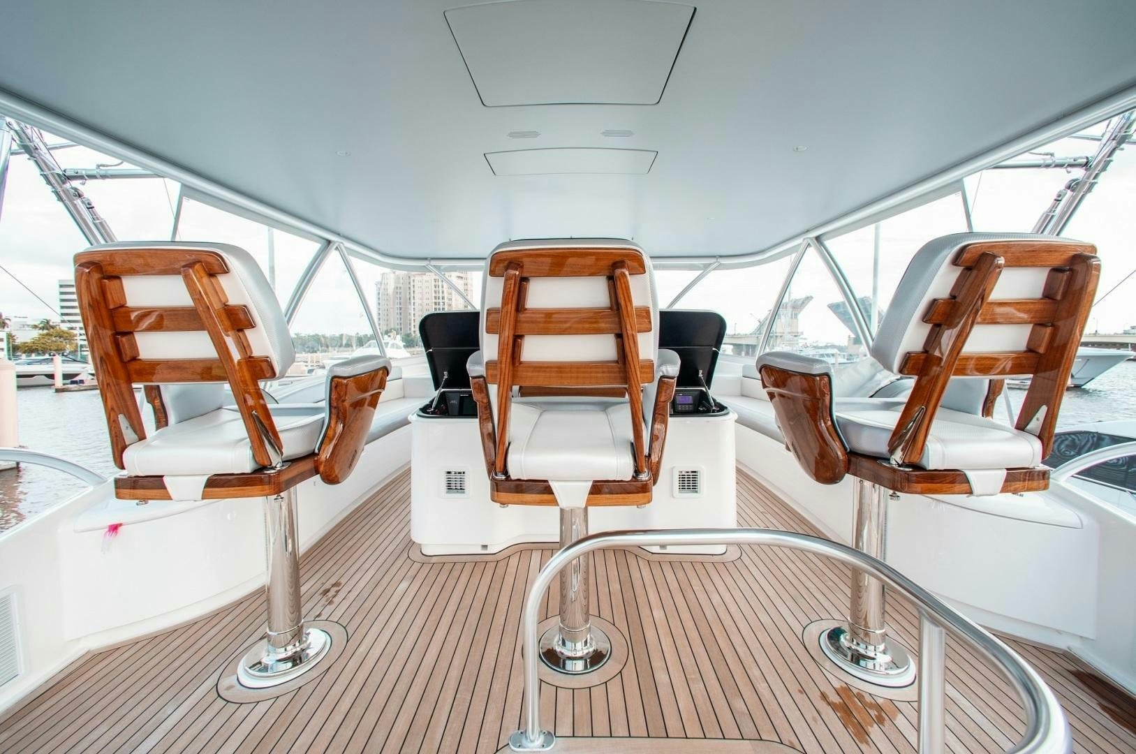 a boat with chairs and tables aboard AEI Yacht for Sale