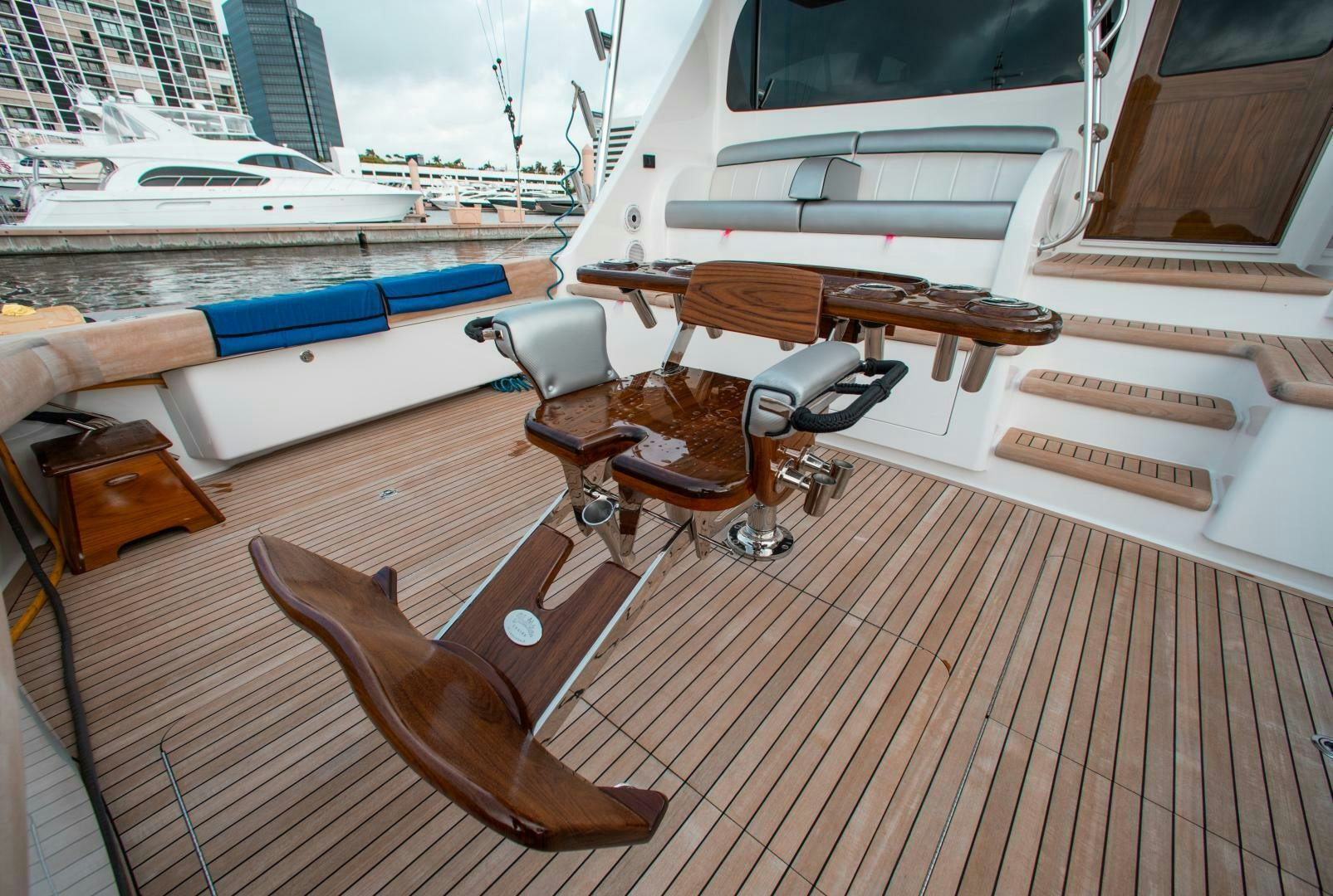 a deck with a boat and a steering wheel on it aboard AEI Yacht for Sale
