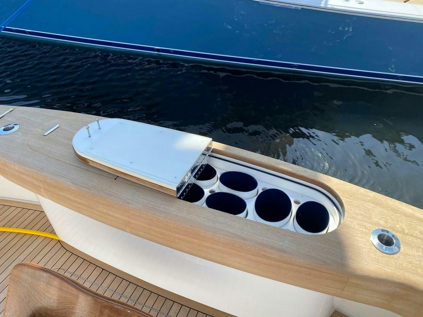 a white rectangular object on a wooden surface aboard AEI Yacht for Sale