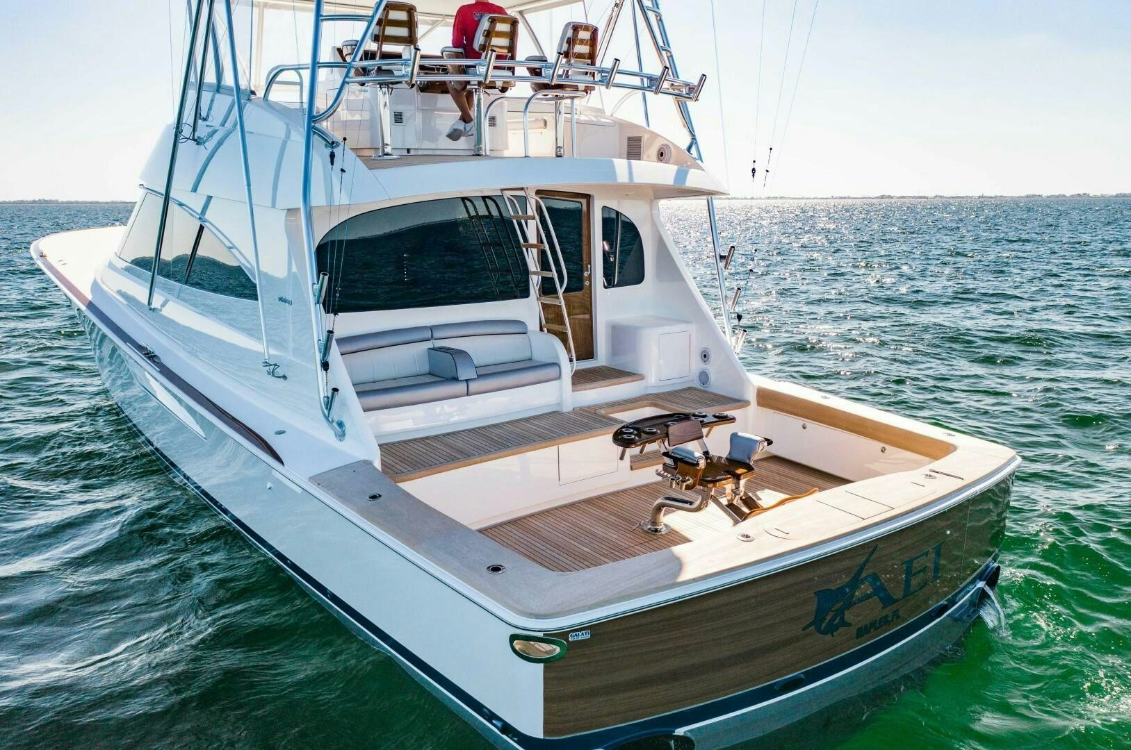 a white boat in the water aboard AEI Yacht for Sale