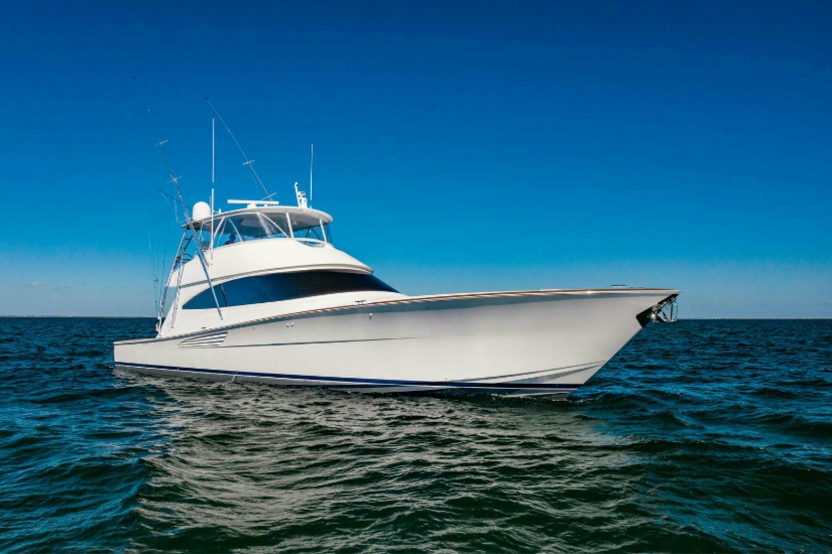 a white boat in the water aboard AEI Yacht for Sale