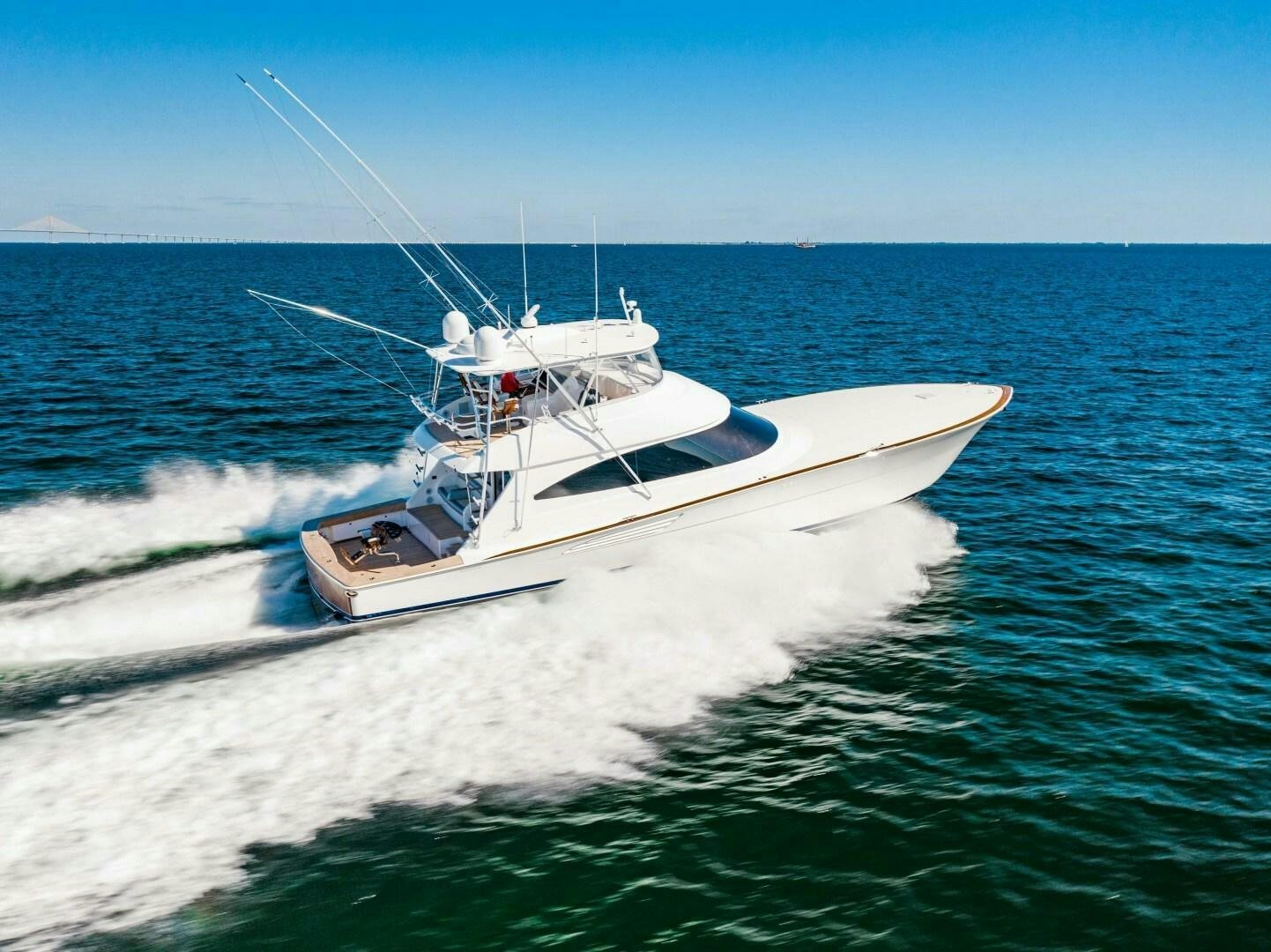 a white boat on the water aboard AEI Yacht for Sale