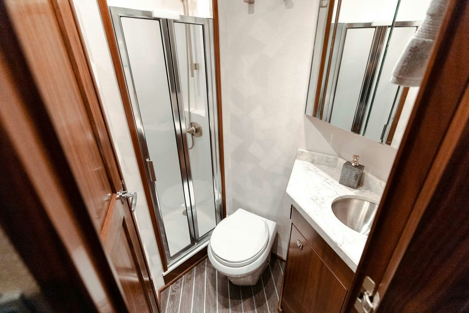 a bathroom with a sink and a toilet aboard AEI Yacht for Sale