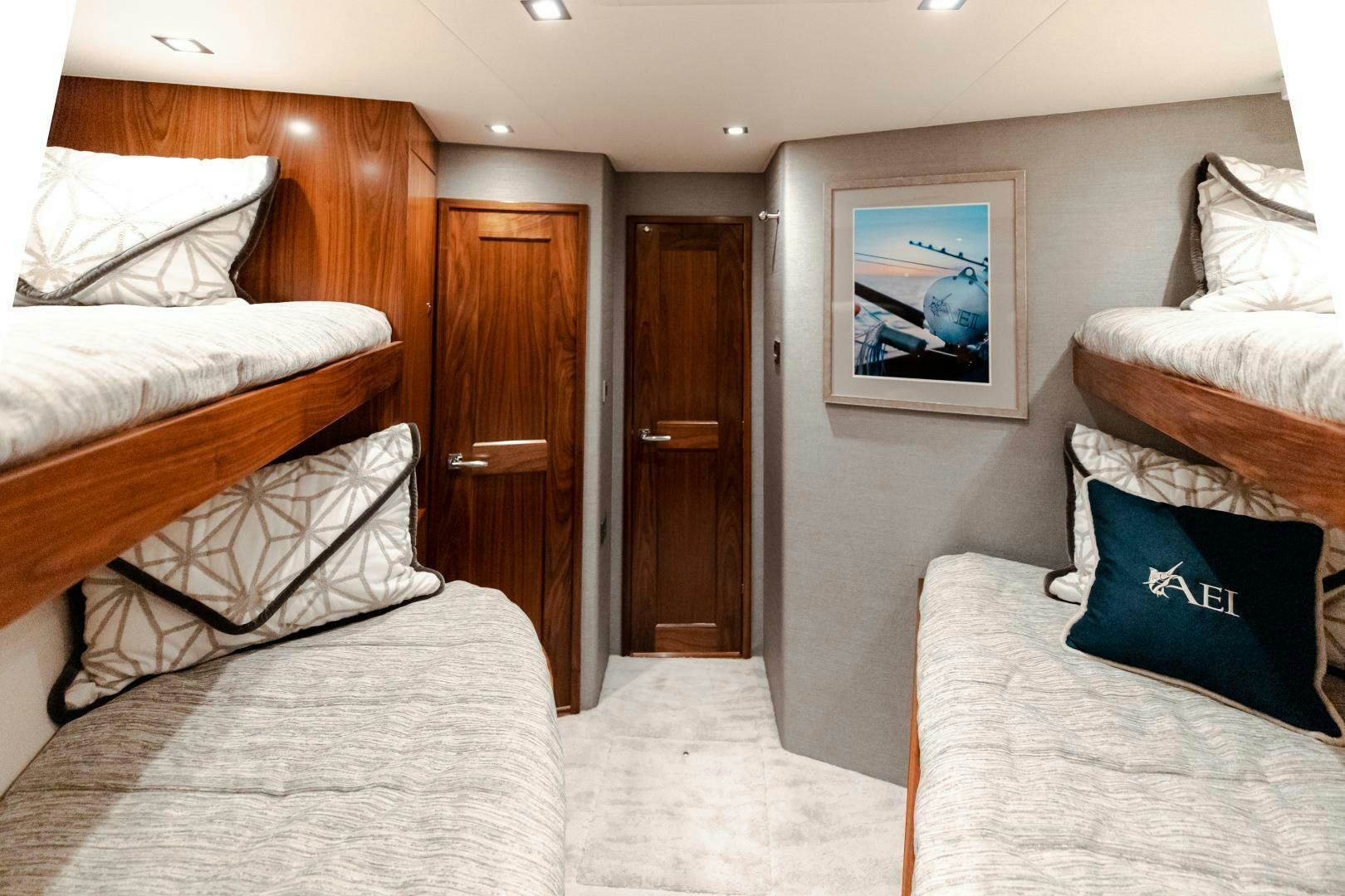 a room with a bed and a door aboard AEI Yacht for Sale