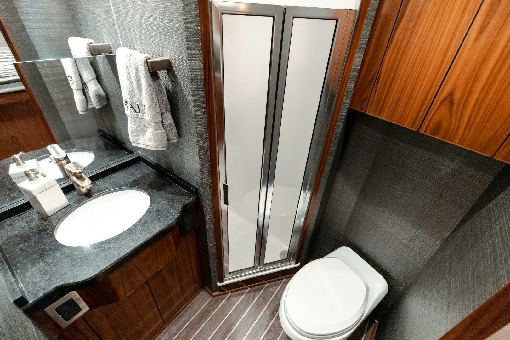 a bathroom with a sink and a toilet aboard AEI Yacht for Sale