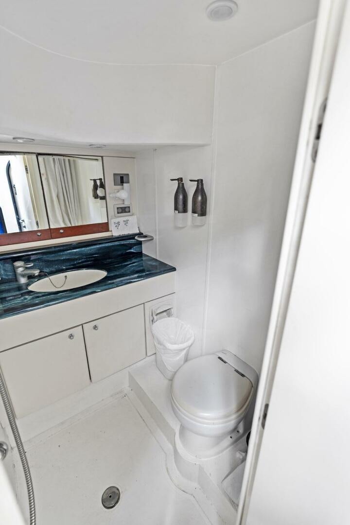 a bathroom with a sink and a toilet aboard PERSISTENCE Yacht for Sale