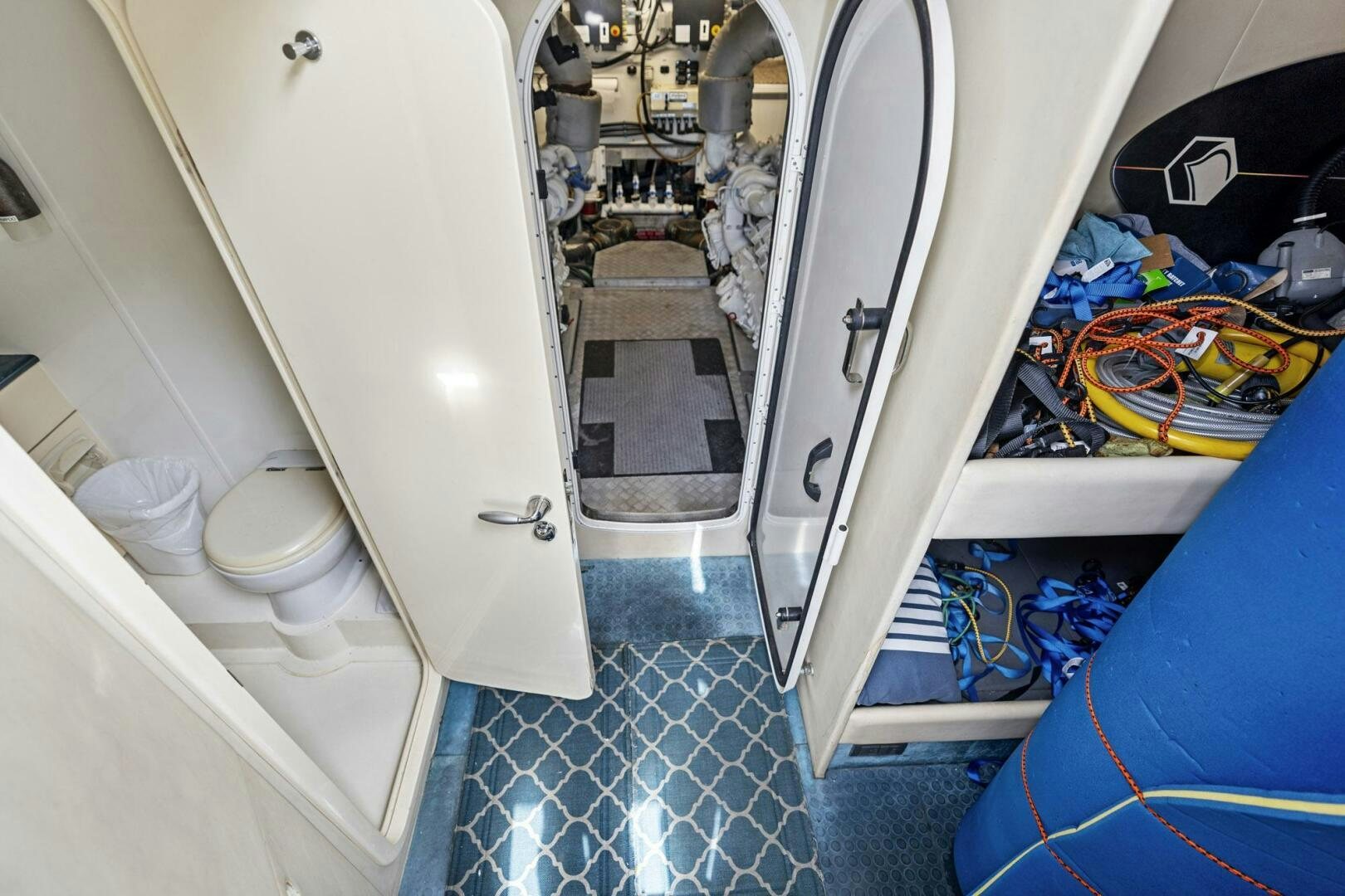 a toilet with a sink and a mirror aboard PERSISTENCE Yacht for Sale