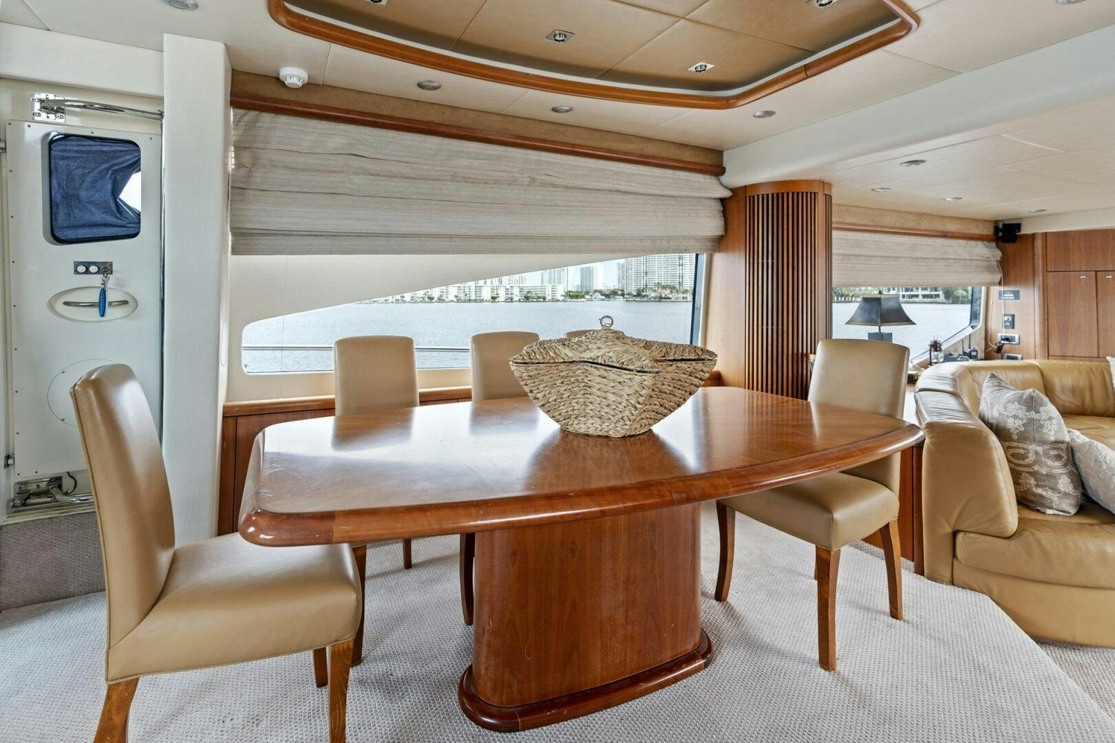 a table with chairs and a couch aboard PERSISTENCE Yacht for Sale