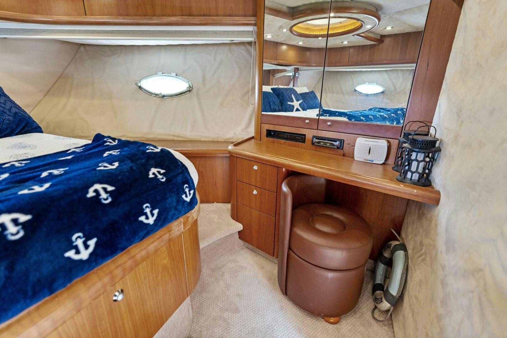 a wooden cabinet with a wooden shelf aboard PERSISTENCE Yacht for Sale