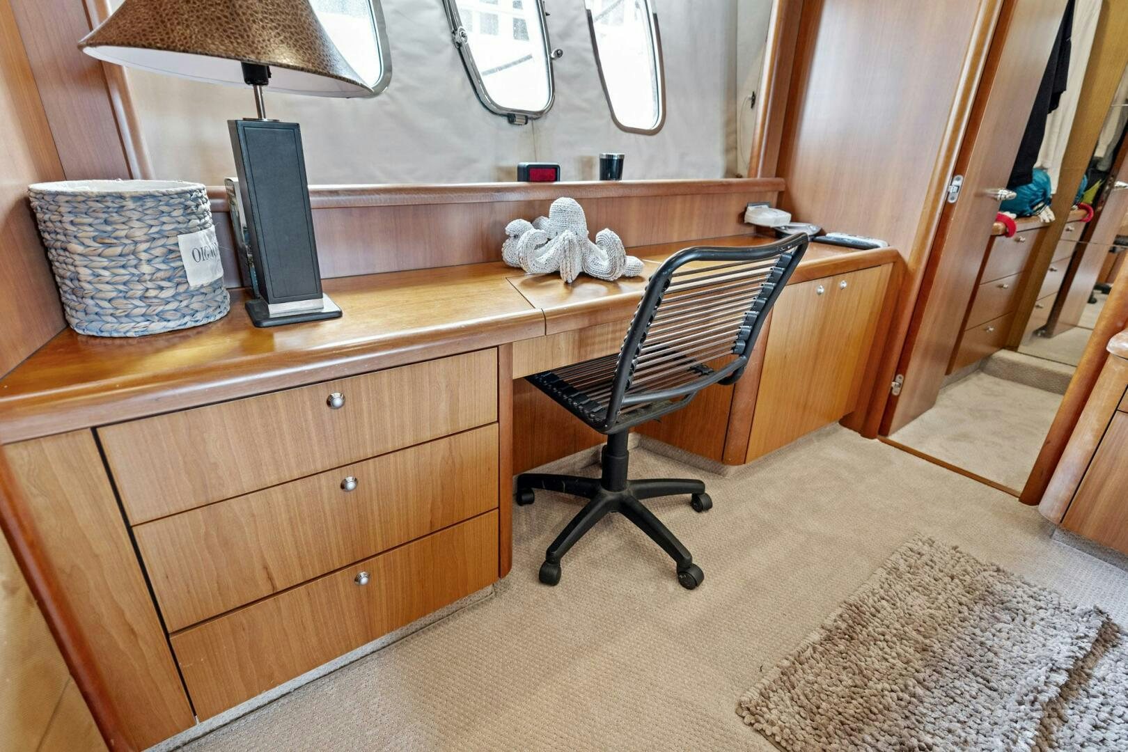 a desk with a chair and a cat on it aboard PERSISTENCE Yacht for Sale