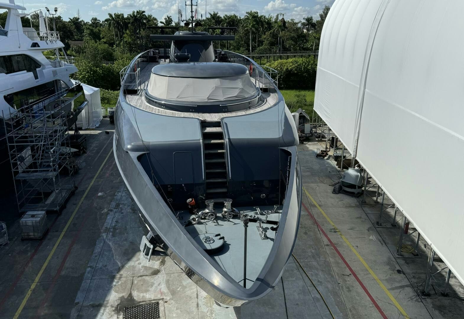 a large white boat on a trailer aboard MATRIX Yacht for Sale