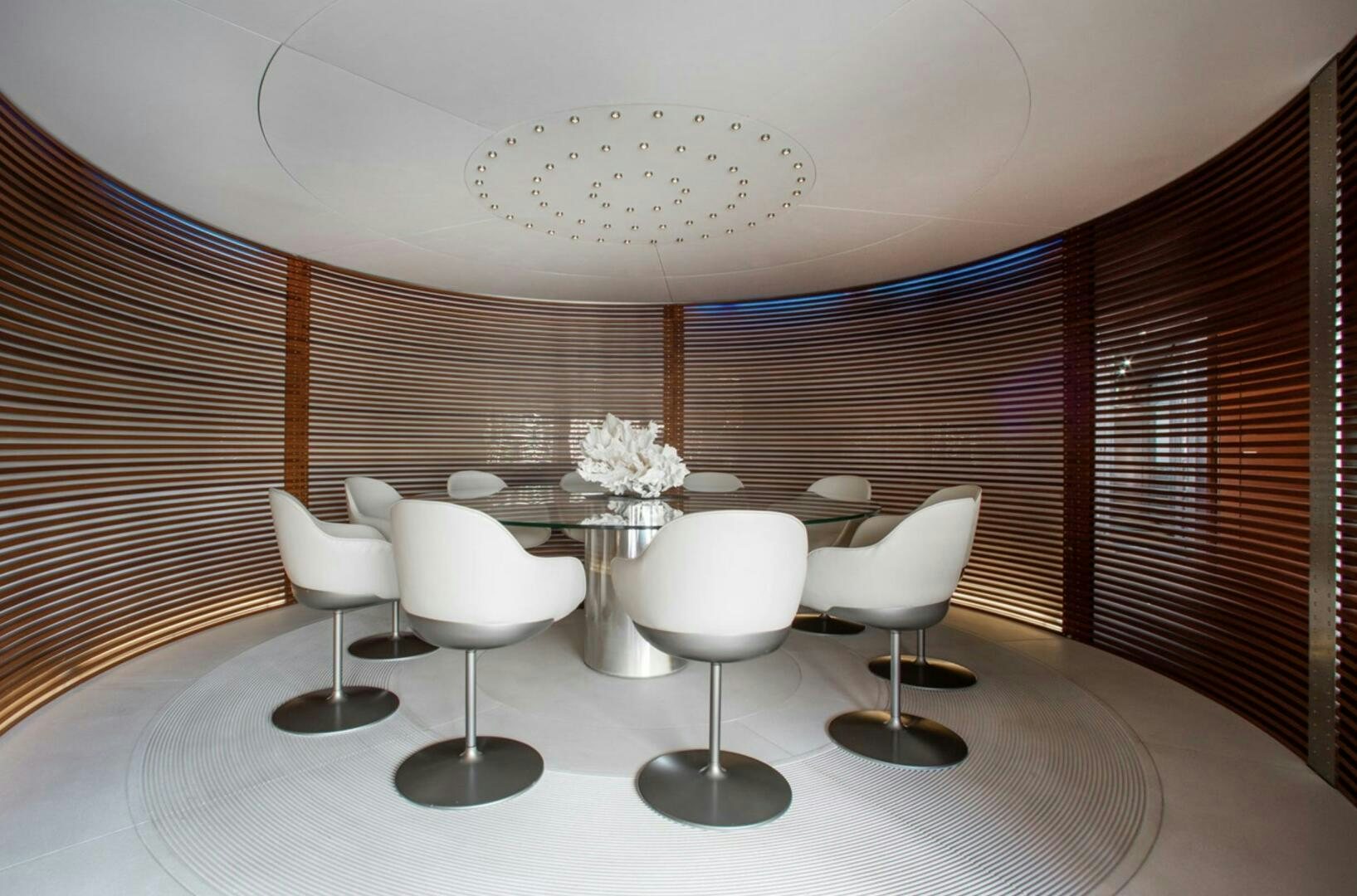 a room with a table chairs and a window aboard MATRIX Yacht for Sale