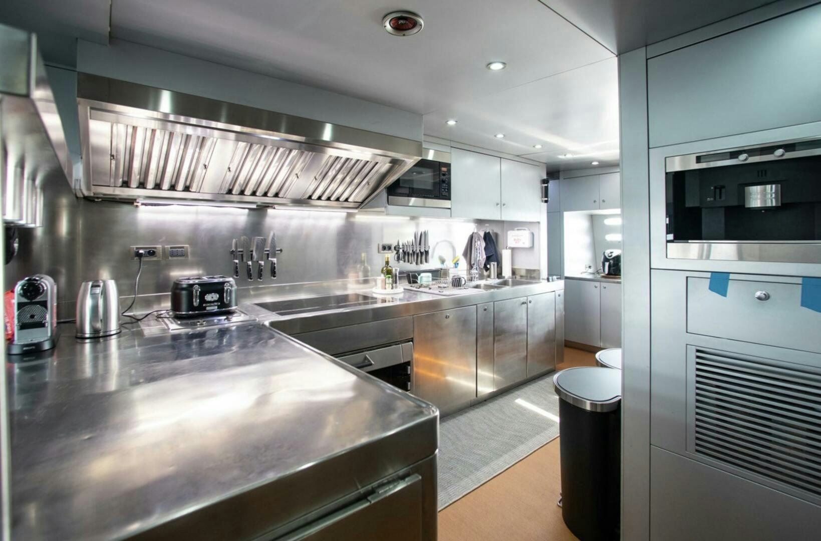 a kitchen with stainless steel appliances aboard MATRIX Yacht for Sale