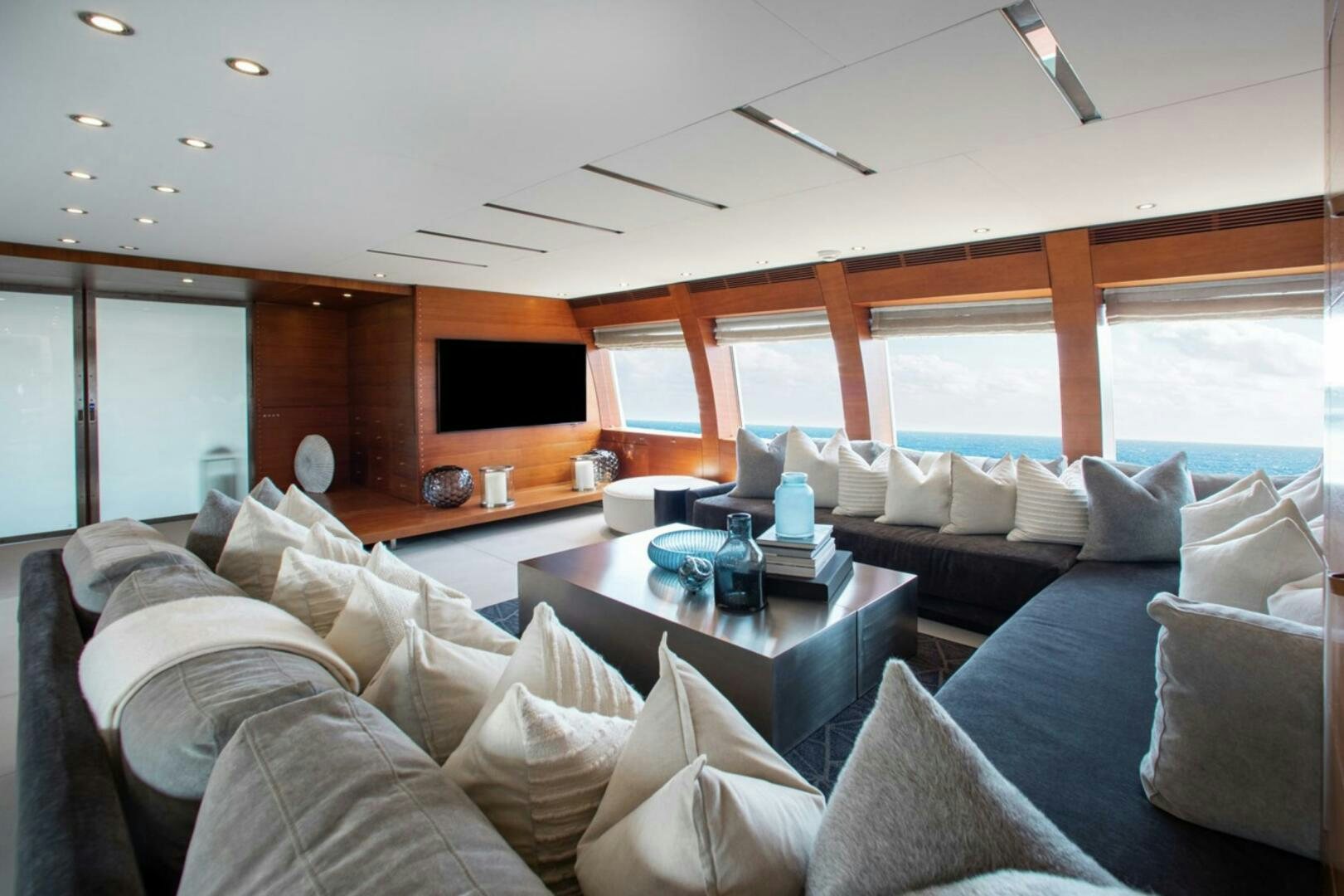 a living room with a couch and a coffee table aboard MATRIX Yacht for Sale