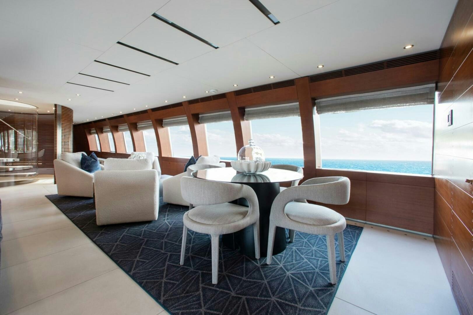 a room with a table and chairs aboard MATRIX Yacht for Sale