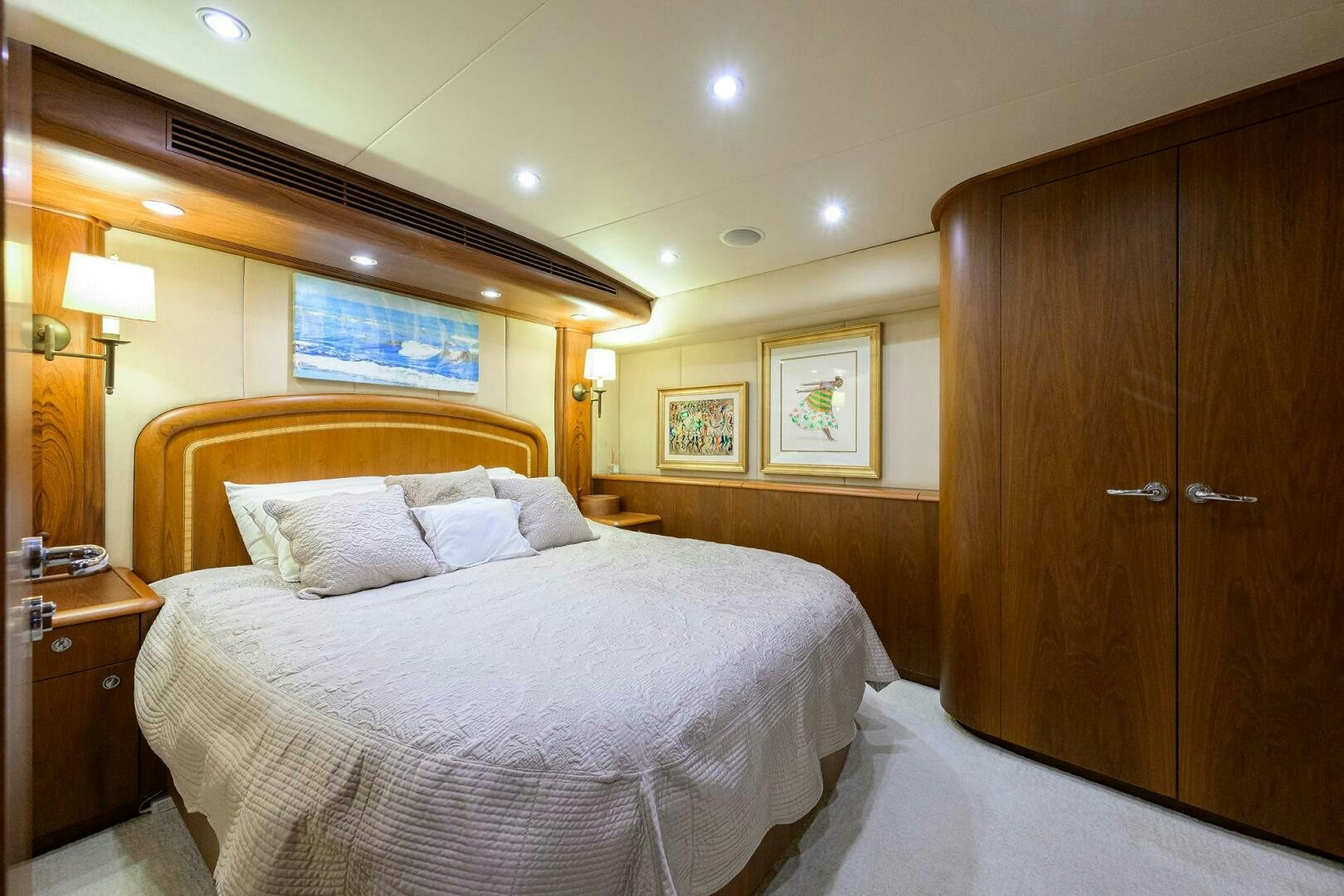 a hotel room with a bed aboard BUSINESS STINKS Yacht for Sale