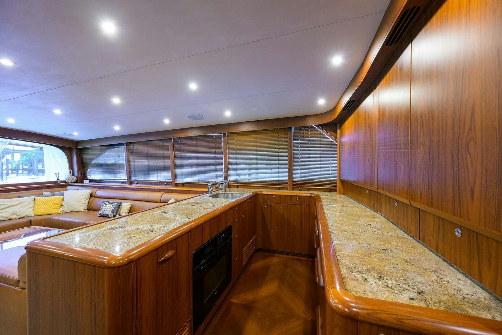 a room with a bed and a desk aboard BUSINESS STINKS Yacht for Sale