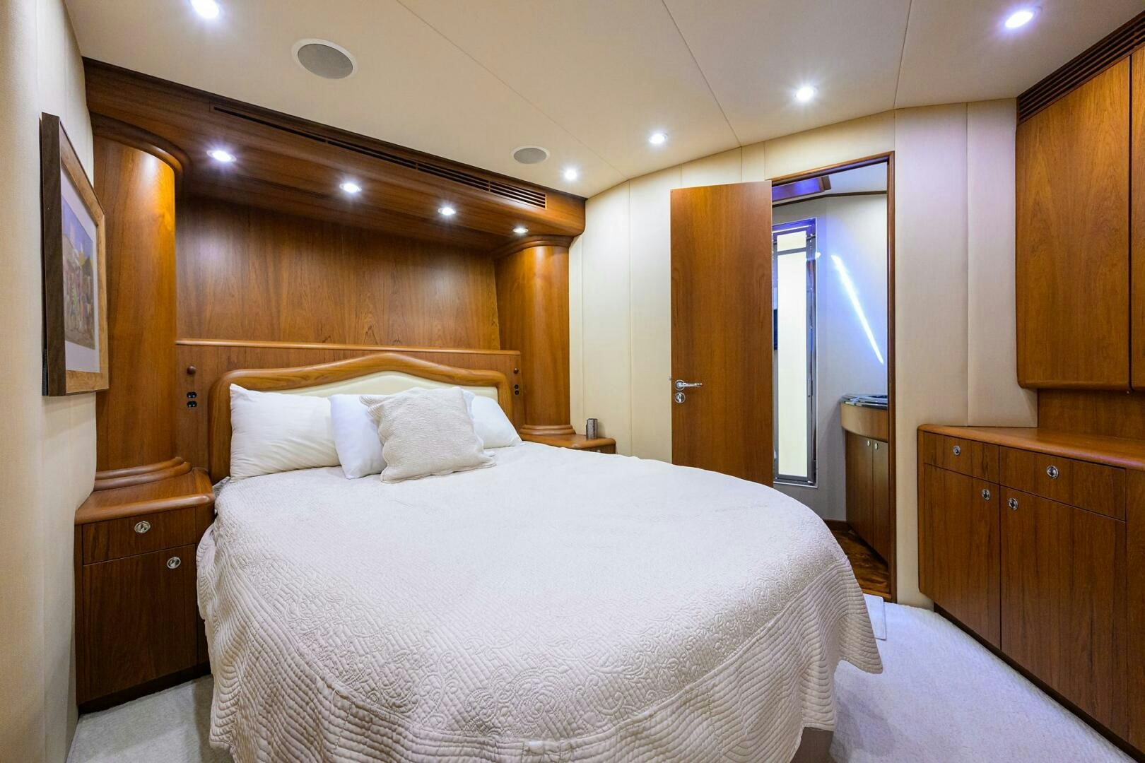 a bed in a room aboard BUSINESS STINKS Yacht for Sale