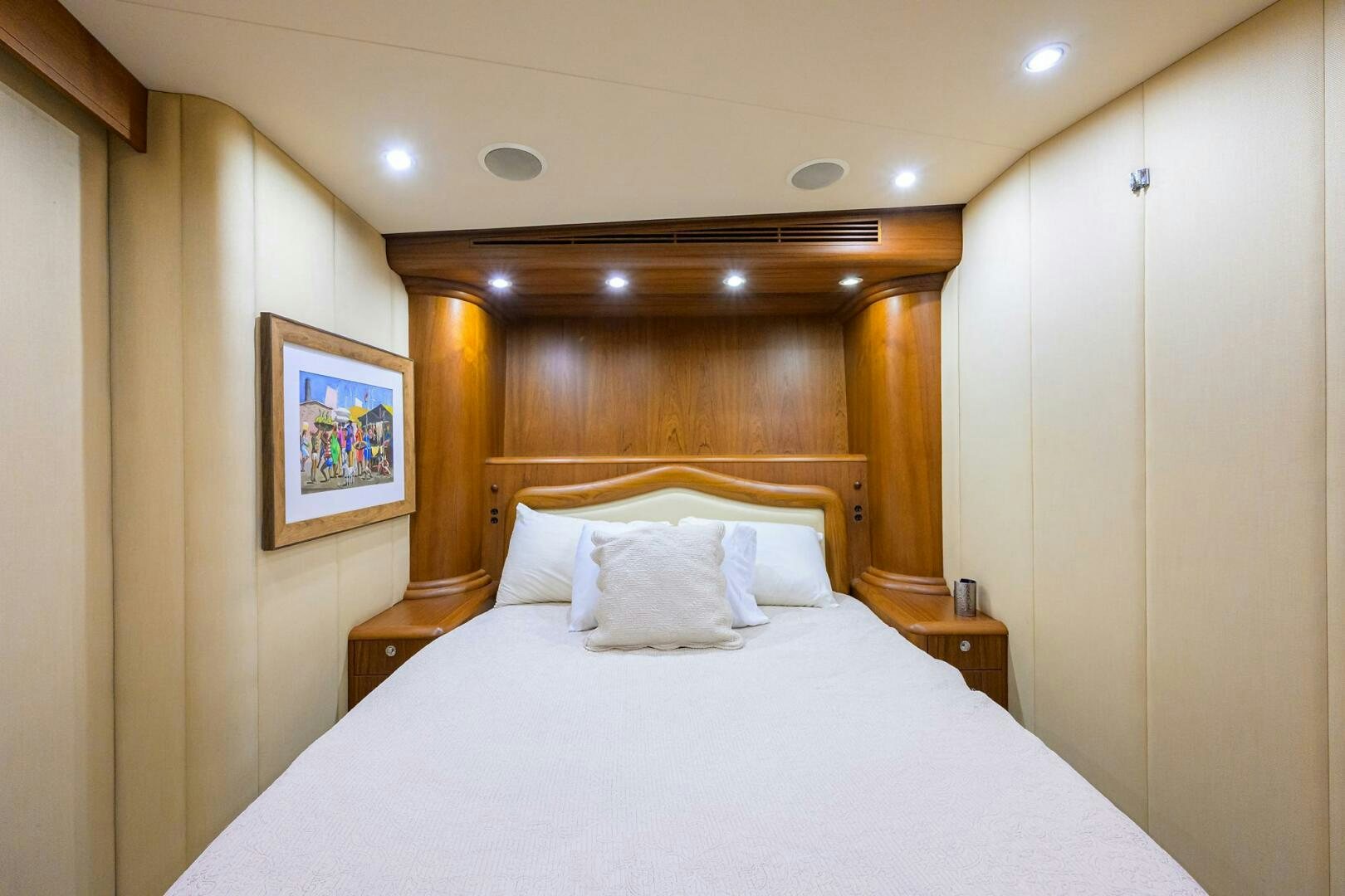 a bed with white sheets aboard BUSINESS STINKS Yacht for Sale