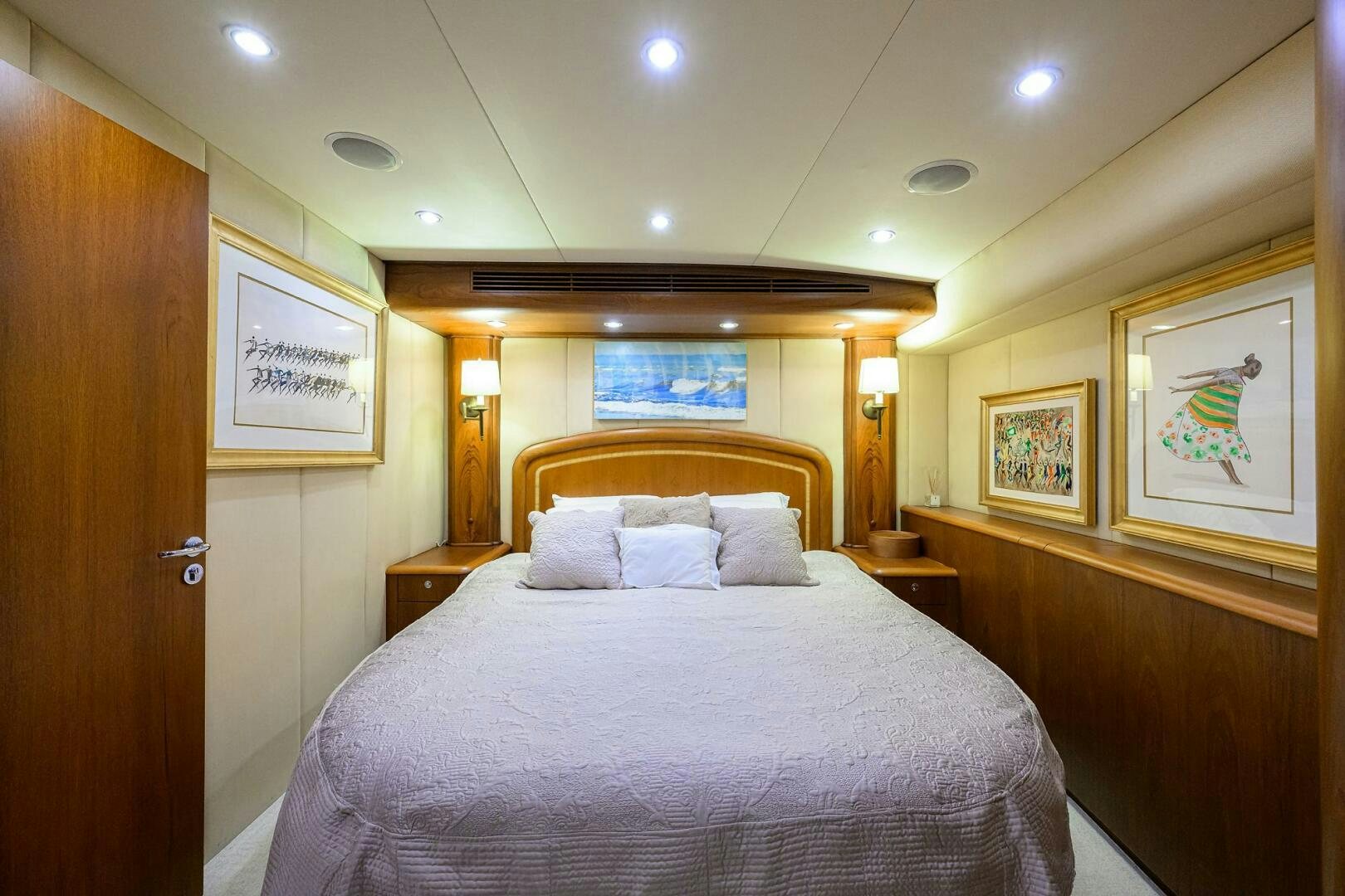 a bedroom with a large bed aboard BUSINESS STINKS Yacht for Sale