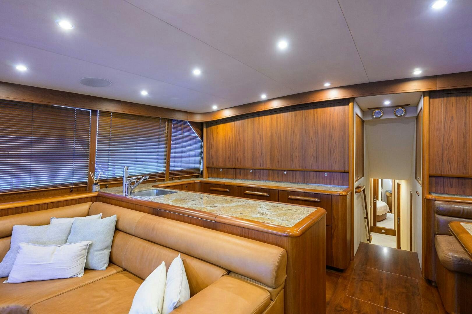a room with a bed and a large window aboard BUSINESS STINKS Yacht for Sale